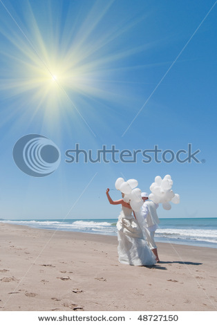 stock-photo-newly-married-couple-on-the-ocean-with-balloons-48727150